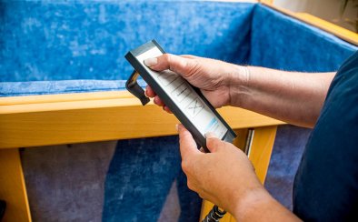 A handset allows the bed to be lifted to a suitable height for carers to work. It also tilts both sides and controls the base inside.